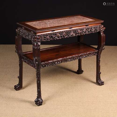 A 19th Century Chinese Carved Hardwood Two-tier Centre Table...