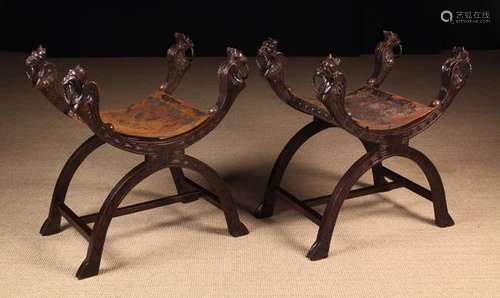 A Pair of 19th Century carved Walnut X-framed Stools.