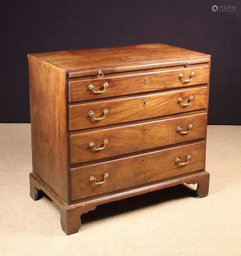 A George III Mahogany Chest of Drawers with Brushing Slide.