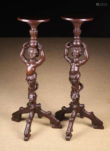 A Pair of Unusual Carved Figural Torchères.