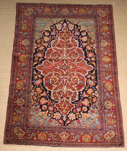 A Persian Carpet woven with interlaced scrolling stems on a ...