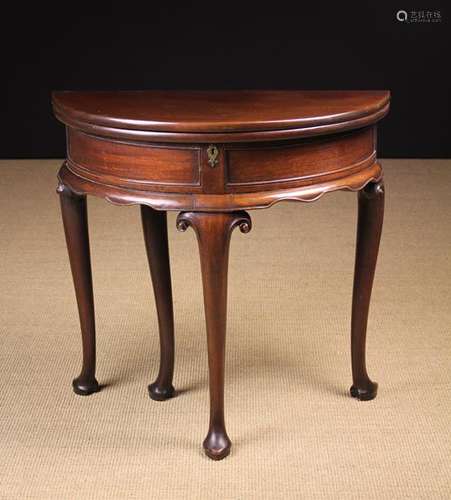 A George II Mahogany Demi-lune Fold-over Side/Card Table.