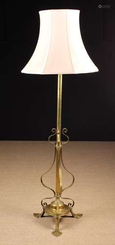 An Art Nouveau Brass Standard lamp having a telescopic heigh...