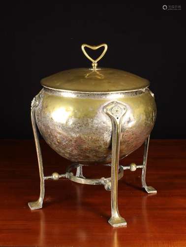 An Art Nouveau Brass Coal Urn with residual silvering,