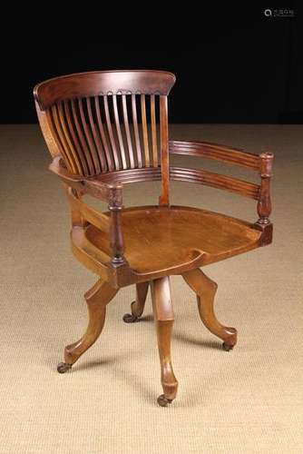 A Late 19th Century Walnut Revolving Desk Chair, by E.W. God...