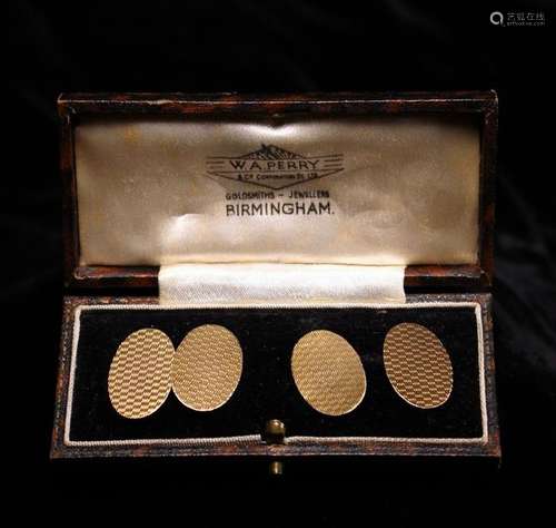 A Pair of 9 Carat Gold Cufflinks, oval with guilloche machin...