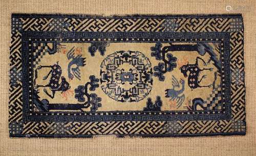 A Small Chinese Table Carpet (A/F) woven in blue on an ivory...