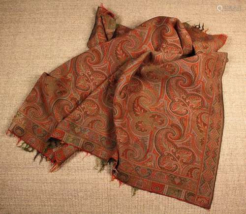 A Paisley Shawl/Throw woven with typical teardrop motifs pre...