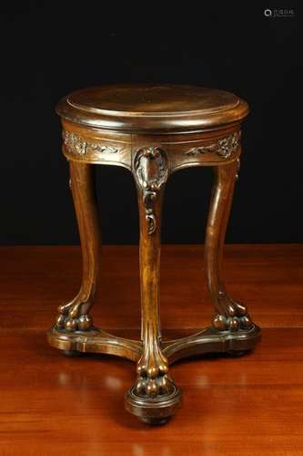 A Carved Mahogany Stand.