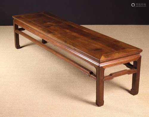 A 19th Century Chinese Rosewood Long Low Table standing on s...