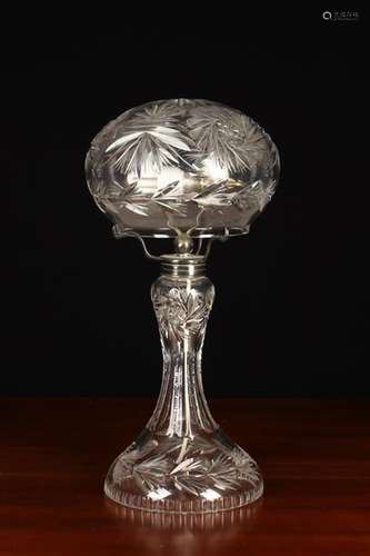 A Cut Glass Table Lamp with domed shade and a baluster stem ...