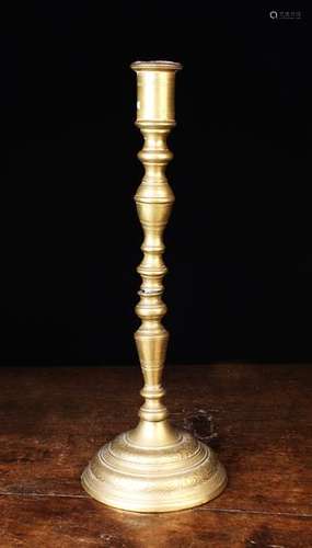 A Tall 18th Century Bronze Candlestick cast in three section...