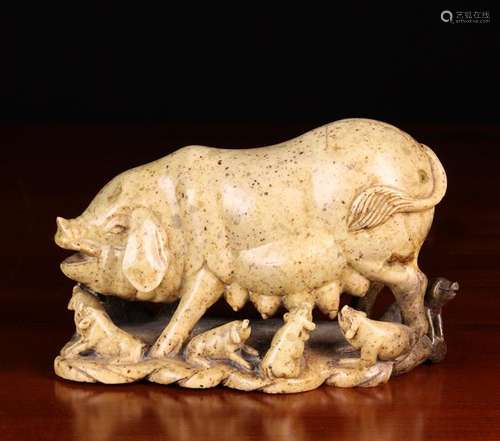 A Soapstone Carving of a Sow and Piglets, 6