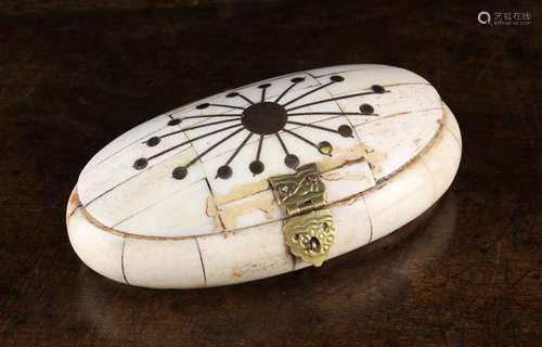 An Ovoid Trinket Box clad in segments of bone and inlaid wit...