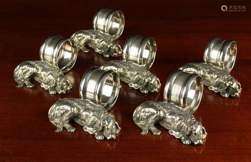 A Set of Six Ornamental Napkin Rings with white metal mounts...