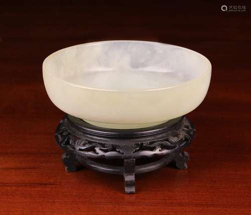 A Fine Pale Celedon Green Jade Bowl with raised foot, mounte...