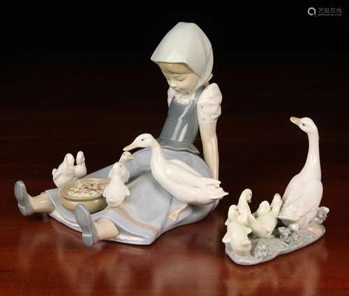 Two Lladro Ornaments: One modelled as a girl sat on ground w...