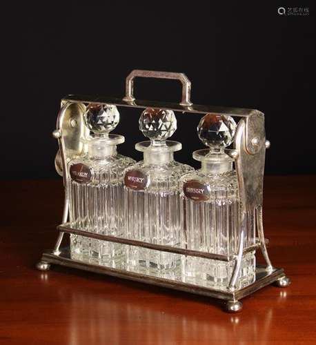 A Silver Plated Three Bottle Tantalus.