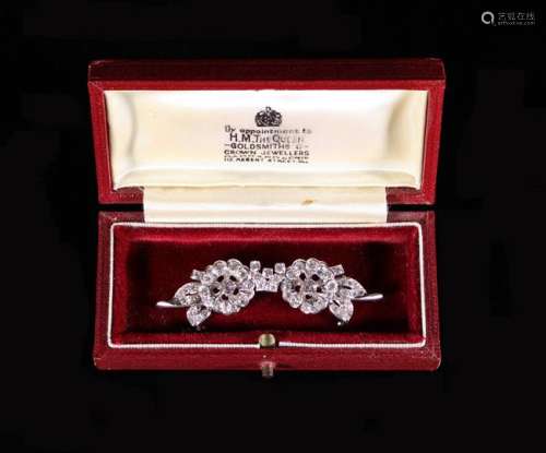 A Pretty Diamond Encrusted Brooch fashioned as two conjoined...