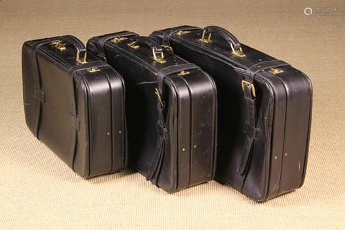 A Set of Three Graduated Black Leather Suitcases reputedly b...