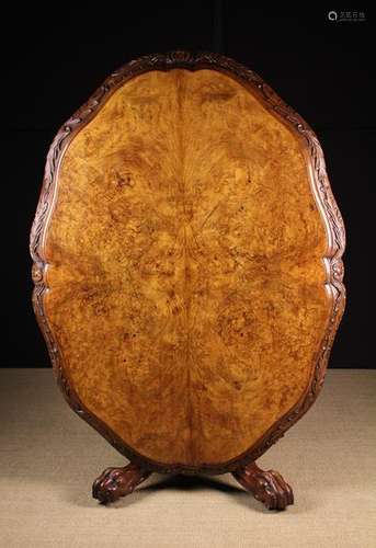 A 19th Century Irish Figured Walnut Tilt-top Table.