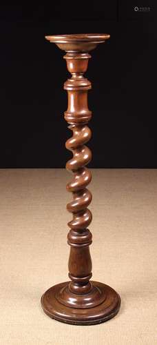 A Mahogany Torchère.