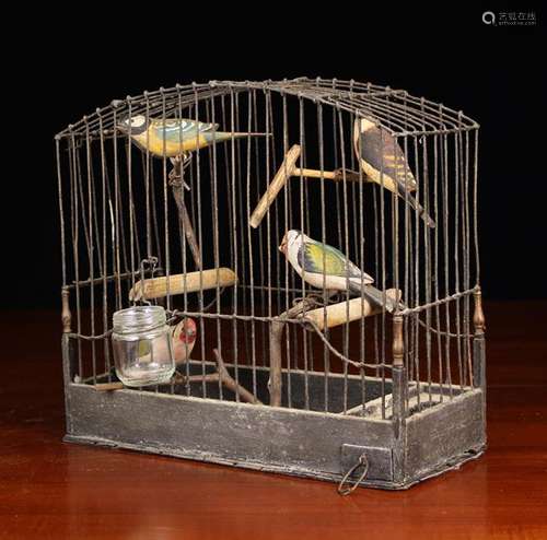 A Small Antique Wire Bird Cage and four carved & painted woo...