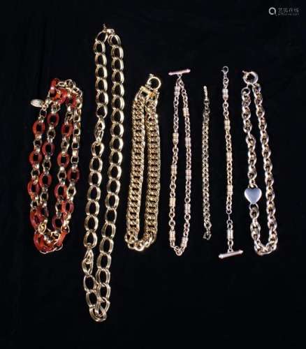 Five Gold Coloured Necklaces and two Bracelets.