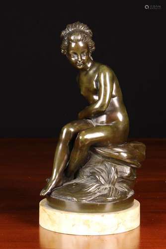 A Bronze Figure of Young Female Bather sat on a grassy clump...