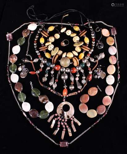 A Group of Seven Necklaces of coloured stones, glass and she...