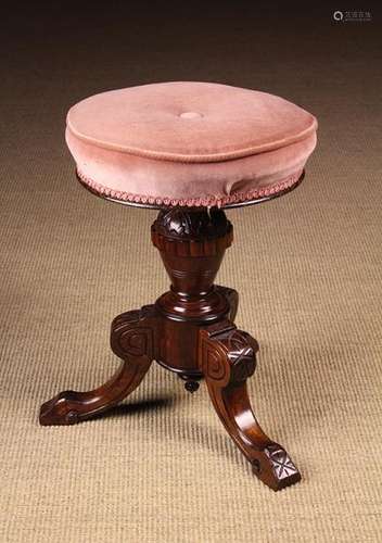 A Late Victorian Piano Stool with rounded cushioned seat on ...