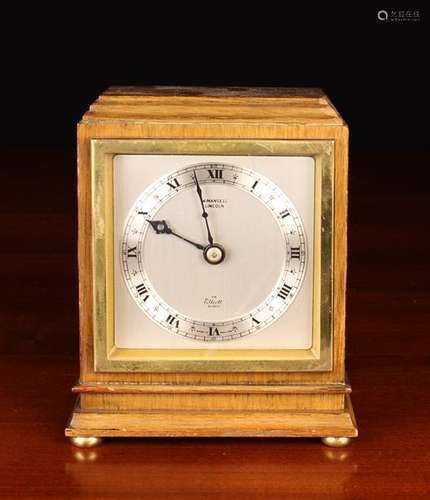 A Mahogany Cased 'Elliott Clock'. The square brushed steel f...