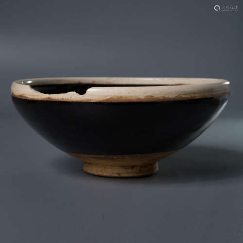 A Black Glaze Porcelain Bowl, with Dents on Edge