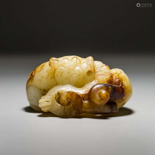 A Carved Jade Beast, with Some Dents