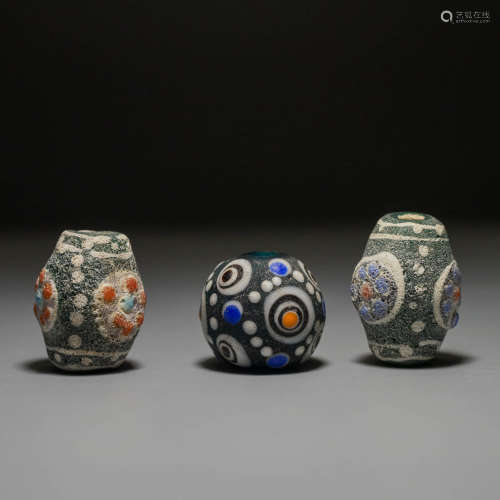 A Set of Three Glass Beads