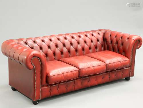 A DEEP BUTTONED RED LEATHER CHESTERFIELD SOFA