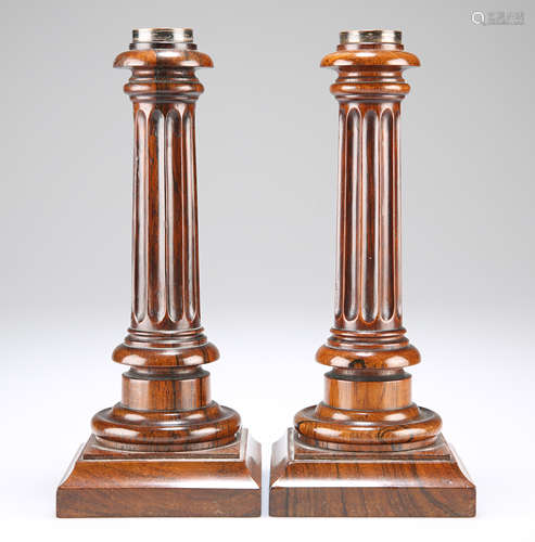 A PAIR OF GEORGE III ROSEWOOD CANDLESTICKS