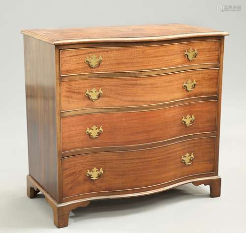 A GEORGE III STYLE MAHOGANY SERPENTINE CHEST OF DRAWERS