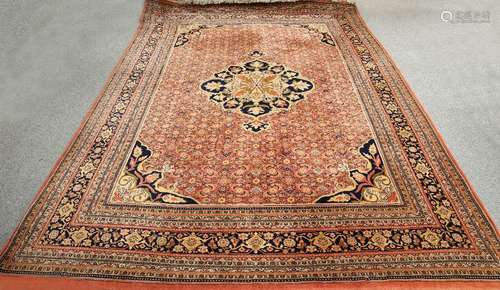 A LARGE INDIAN CARPET