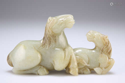 A CHINESE JADE CARVING OF TWO HORSES