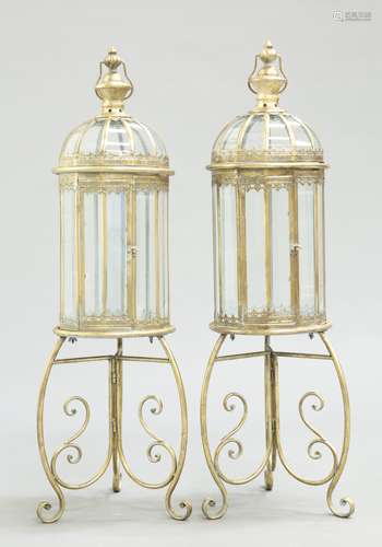 A PAIR OF PERIOD STYLE BRASS LANTERNS ON STANDS