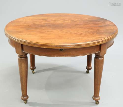 A LATE VICTORIAN MAHOGANY EXTENDING DINING TABLE