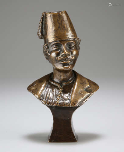 A CAST BRONZE HEAD AND SHOULDERS STUDY OF A MOUSTACHIOED MAL...