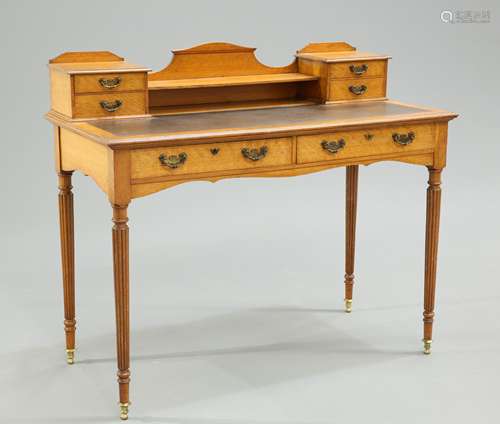 AN EDWARDIAN GOLDEN OAK WRITING DESK