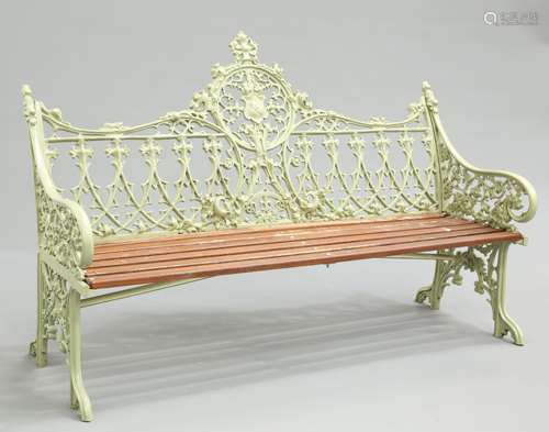 A GREEN PAINTED METAL GARDEN BENCH