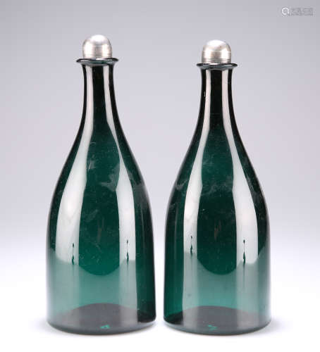 A PAIR OF EARLY 19TH CENTURY GREEN GLASS FLASK DECANTERS WIT...