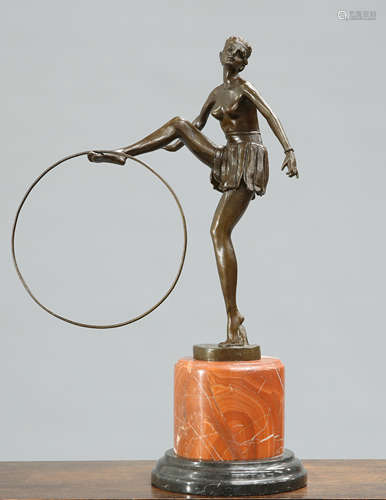 AN ART DECO STYLE BRONZE FIGURE OF A HOOP GIRL