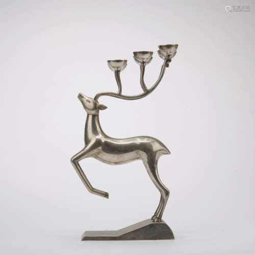 A silver deer candlestick