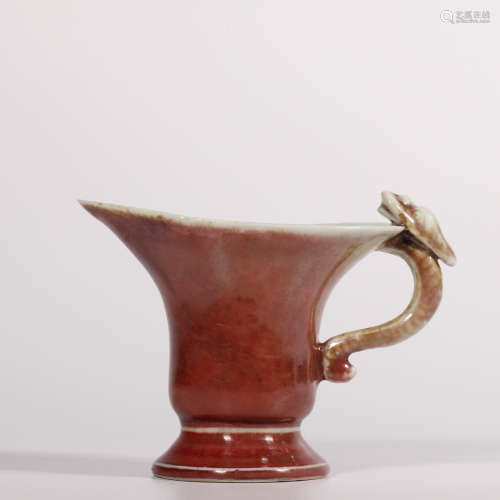 A red glazed wine cup