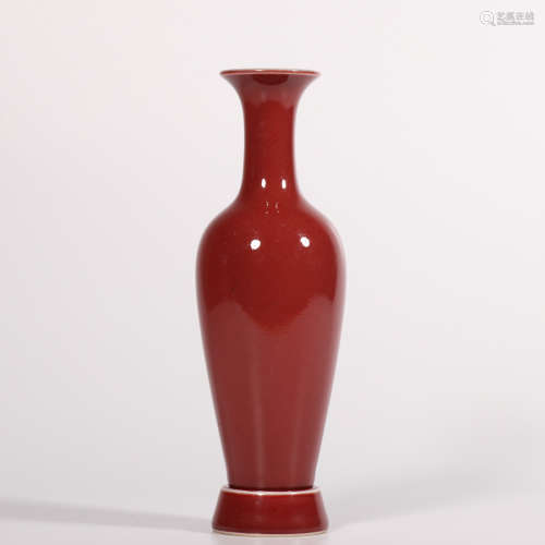 A red glazed vase